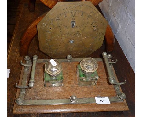 Victorian desk inkstand with pen rests and two glass inkwells together with a sundial having damaged gnomon