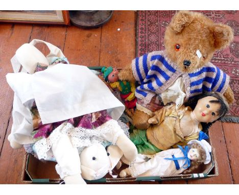 Vintage dolls, puppets and a Teddy Bear in a dress.