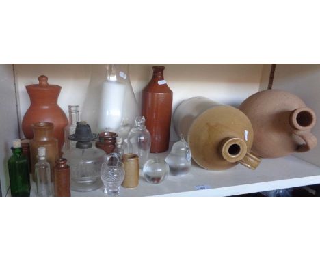 Assorted item including glass paperweights, stoneware jar, and bottles etc