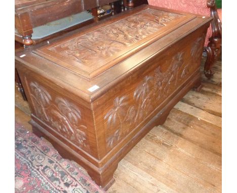 Large Indian rosewood chest with carved elephants and palm trees panel on the lid, with a fitted inner rosewood tray, standin
