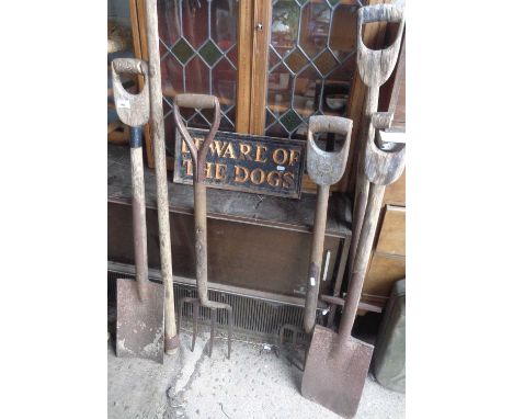 Vintage cast iron sign reading "Beware of the Dogs" and 6 old garden tools.