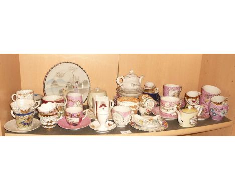 Large collection of Victorian seaside souvenir and pink lustre cups and saucers including moustache cups
