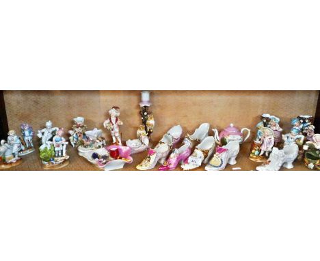 Large collection of porcelain shoes, fairings, Victorian china figurines, etc (shelf of)
