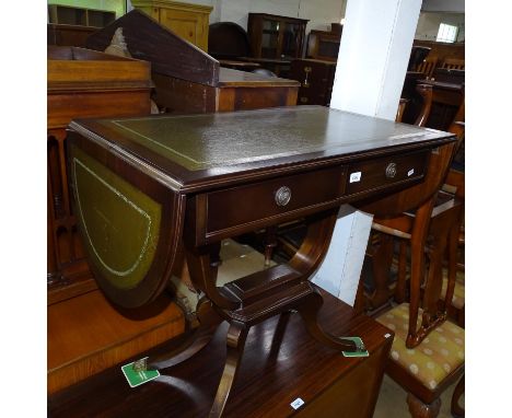 A reproduction mahogany 2-drawer sofa table on yolk support and sabre leg, W88cm, H76cm, D52cm 