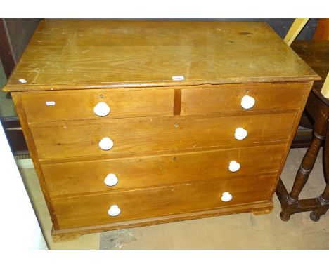 A Heals &amp; Son pine chest of 2 short and 3 long drawers, with ceramic handles, and bracket feet, impressed to the top of t