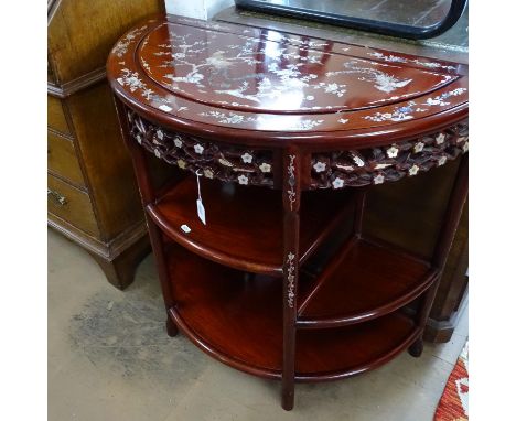 A Chinese hardwood demi-lune 3-tier console table, with a carved and pierced frieze and allover mother-of-pearl and abalone i