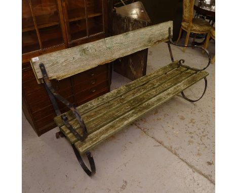 A scrolled wrought-iron and slatted garden bench, W160cm 