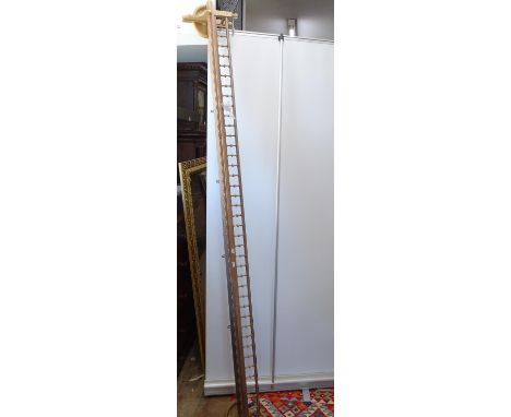 A long pine narrow hanging shelf, with spindle turned gallery, L225cm approx 