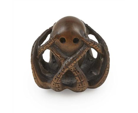WOOD NETSUKE OF A OCTOPUS MEIJI PERIOD worked as an octopus with up curled tentacles, inserted with glass eyes, the base inci