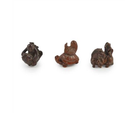 COLLECTION OF THREE WOOD NETSUKE MEIJI PERIOD the first as a turtle with a chicken on its back, each with small glass eyes, t