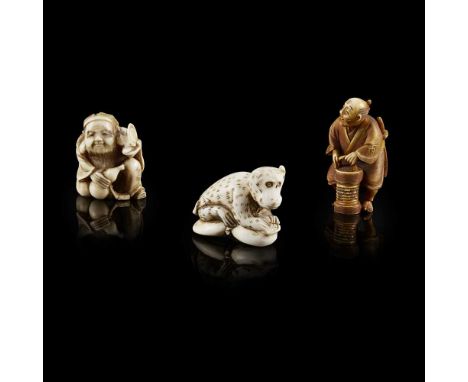 Y COLLECTION OF THREE IVORY NETSUKE  MEIJI PERIOD comprising a reclining monkey, signed 'Eiki' on the base; a smiling elder h