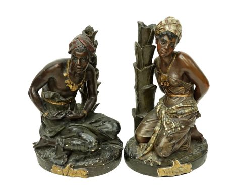 Pair of French Polychrome Pottery Orientalist Male and Female Slave Figures. Unsigned. Measures 19" H x 12" W. Condition: Los