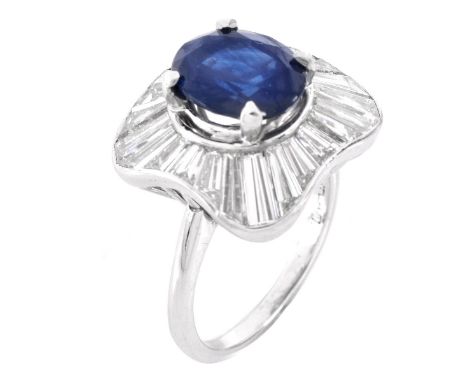 2.75 Carat Oval Cut Sapphire, 5.0 Carat Tapered Baguette Cut Diamond and Platinum Cocktail Ring. Sapphire with vivid color. D