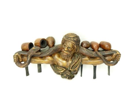 Vintage Carved Wood "Orientalist" Pipe Holder. Holds 6 pipes. Unsigned. Measures 16" W. Condition: Wear, losses. Domestic Shi