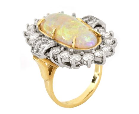 Vintage 1970s Oval Cabochon Opal, 2.75 Carat Round Brilliant Cut Diamond and 18 Karat Yellow and White Gold Ring. Opal measur