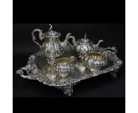 Five Piece Georgian Silver Coffee And Tea Service. The set comprised of coffee pot, tea pot, sugar and cream pitcher. Depress