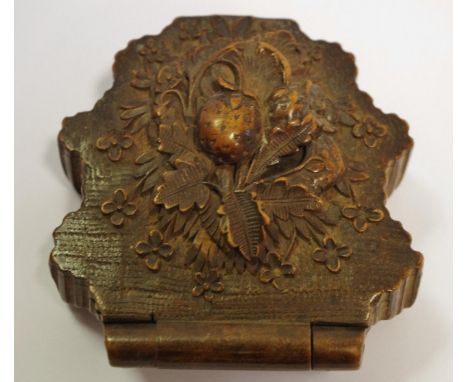 A Black Forest pocket watch stand, folding for travel, carved with fruiting vine, 8cm long, c.1870 