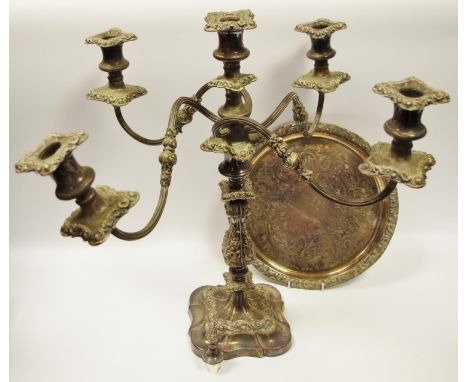 A silver plate on copper five light four branch table candlestick, 54cm high, late 19th century;  a die stamped tray (2) 