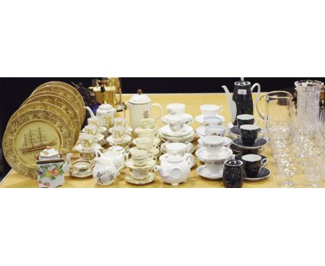 A Japanese coffee set for eight decorated with a dragon in relief comprising coffee pot, coffee cups &amp; saucers, sugar bow