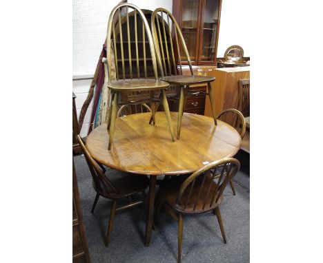 An Ercol dropleaf dining table, four low back dining chairs and two high back dining chairs (7) 
