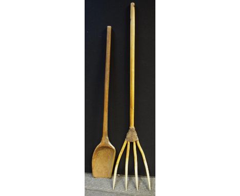 Agricultural Antiques - a 19th century grain shovel;  a leather mounted four prong hay fork (2) 