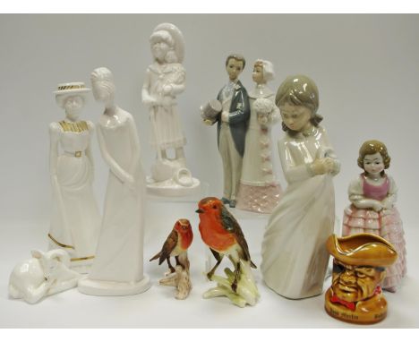 A Goebel Robin; another smaller; a Lladro figural group of Groom &amp; Bride; a NAO figure Girl &amp; Blanket; a Spode figure