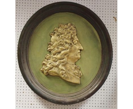 A 19h century portrait relief, of George III, in gilt on a green ground, integrated frame, 66cm diam