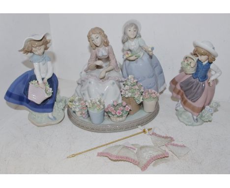 ***Please note amended image****A Lladro figural group of girls selling flowers under a parasol, impressed pattern number 553