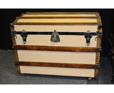 A dome top wood and metal bound trunk, 62cm high x 92cm wide x 57cm deep 