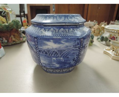 A Ringtons Maling pottery tea caddy having pictorial black and white decoration with script for The North East Coast Industri