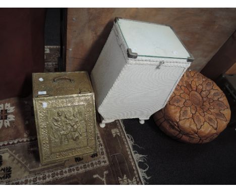 An embossed brass coal purdonium and woven fibre blanket box and a Spanish style leather pouffe