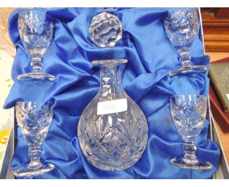 A Royal Doulton boxed decanter and four port glasses