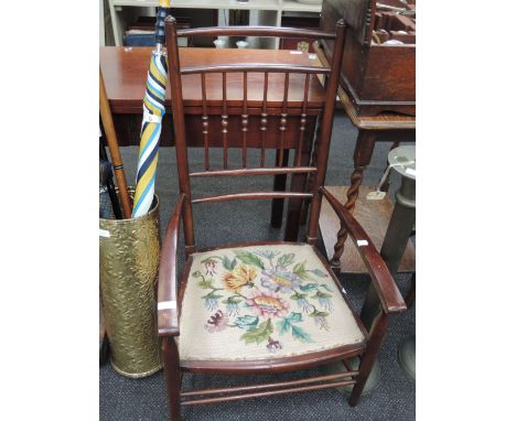 An Edwardian mahogany frame bedroom/occasional chair having spindle back, with tapestry seat and turned frame
