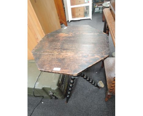 A 19th century pine and stained frame gypsy table having hexagonal top and bobbin legs