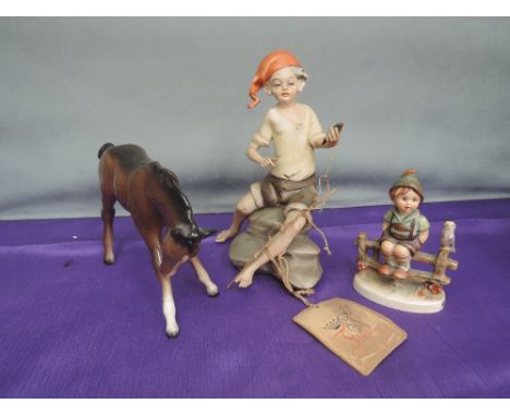 A Beswick study, foal, brown 947, a Hummel figurine, Wayside Harmony and a Capo Di Monte figurine, boy fishing