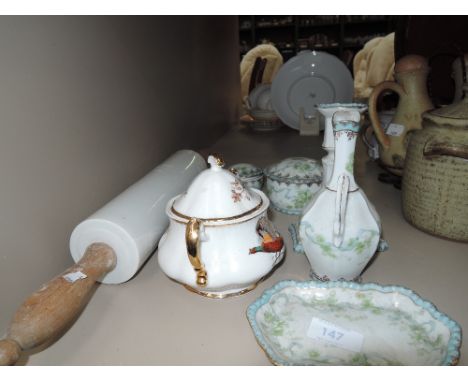 A selection of decorative ceramics and marble rolling pin