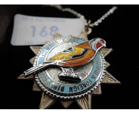 A white metal and enamel pendant and chain for The Northwest British & Foreign Bird Society