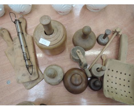 A collection of butter making equipment, including pats, stamps and dairy thermometer