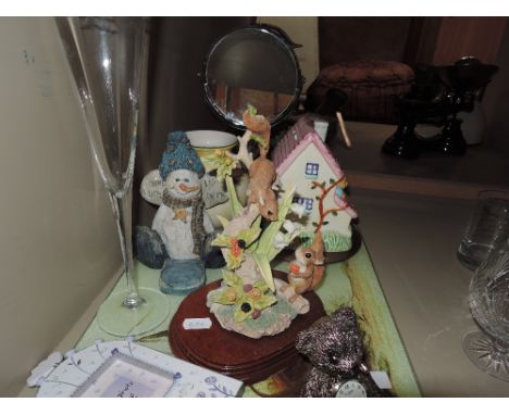 A miscellaneous selection including teddy bear clock, ceramic house piggy bank etc 