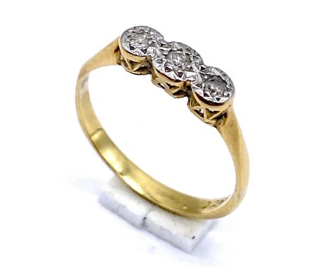 A 18ct gold and platinum three stone diamond ring, size L, total weight 1.7 grams.