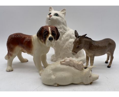 A Beswick model of a cat along with two other Beswick animals (donkey has small chip to ear) and a model of a St. Bernard