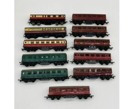 A collection of various unboxed OO gauge model railway passenger coaches, mainly Tri-ang including six LMS maroon coaches.