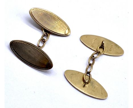 A cased pair of 9ct gold cufflinks with engine turned decoration - 5.9g 