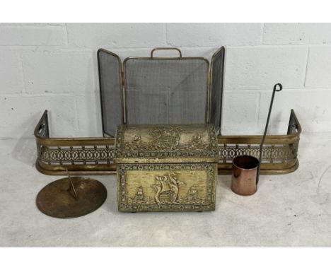 A collection of brass and copper items, including a fire side fender and fire guard, brass sundial etc 