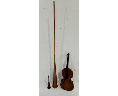 A vintage copper coaching horn, a copper hunting horn and a turn of the century violin, printed inside Antonius Stradivarius 