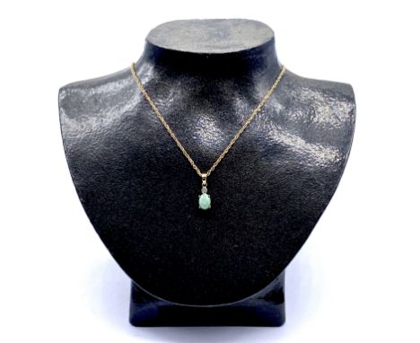 A jade and diamond pendant set in 9ct gold on a fine 9ct gold chain