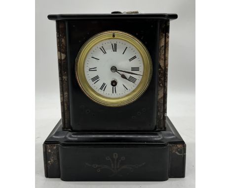 A slate mantle clock, with key.