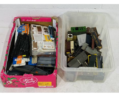 A collection of various OO gauge model railways accessories and spares including buildings, carriages, rolling stock, track, 