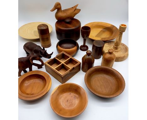 A collection of assorted turned wooden items to include beech candlestick etc.