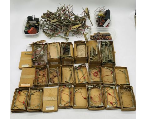 A large collection of vintage Marklin model railway HO/OO gauge catenary masts (boxed and unboxed), along with other model ra